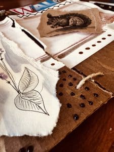 Design and create a three-panel art book using found or recycled materials, then turn it into a nature-inspired journalusing mixed media.